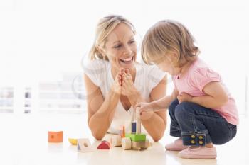 Royalty Free Photo of a Mother and Daughter Playing