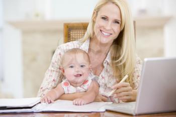Royalty Free Photo of a Mother and Baby at a Laptop