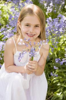Royalty Free Photo of a Little Girl With Bluebells