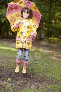 Royalty Free Photo of a Young Girl With an Umbrella