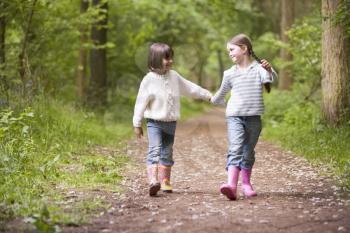 Royalty Free Photo of a Two Girls Walking on a Trail