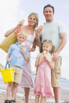 Royalty Free Photo of a Family Eating Ice Cream at the Beach