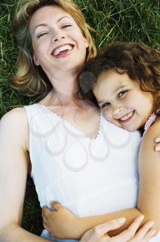 Royalty Free Photo of a Mother and Daughter Lying on the Grass