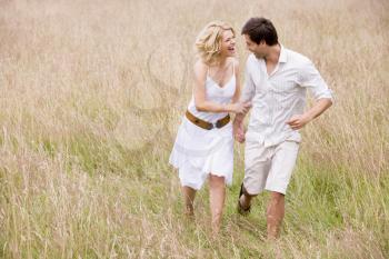 Royalty Free Photo of a Couple in a Field
