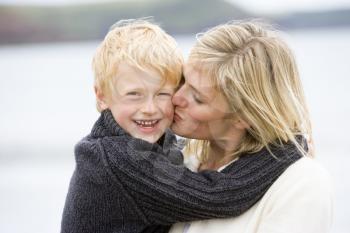 Royalty Free Photo of a Mother Kissing Her Son