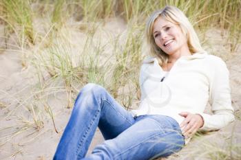 Royalty Free Photo of a Woman Lying on the Sand