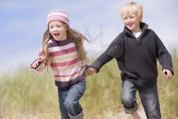 Royalty Free Photo of Two Children Running at the Beach