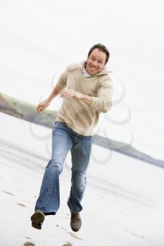 Royalty Free Photo of a Man Running on a Beach