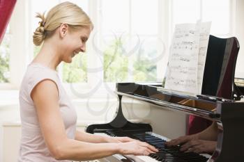 Royalty Free Photo of a Woman Playing Piano