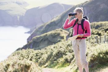 Royalty Free Photo of a Woman With Binoculars on a Trail