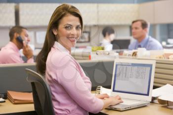Royalty Free Photo of a Woman in an Office Cubicle
