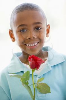 Royalty Free Photo of a Little Boy With a Flower