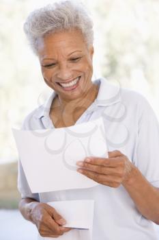 Royalty Free Photo of a Woman Reading a Letter