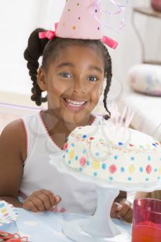 Royalty Free Photo of a Child With a Birthday Cake