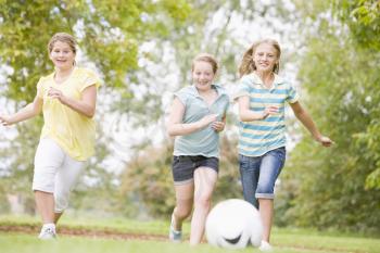 Royalty Free Photo of Girls Playing Soccer