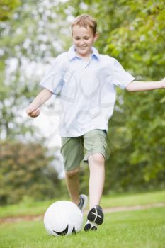 Royalty Free Photo of a Boy Playing Soccer