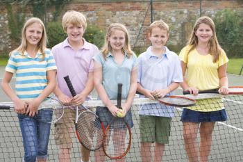 Royalty Free Photo of Children on a Tennis Court