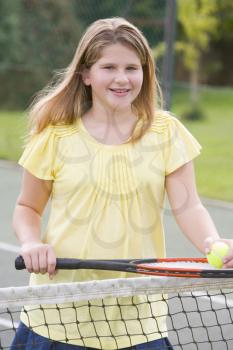 Royalty Free Photo of a Girl With a Tennis Racket