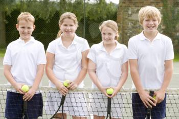 Royalty Free Photo of Kids at a Tennis Court