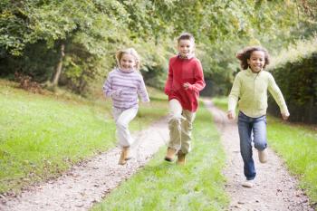 Royalty Free Photo of Children Running on a Path