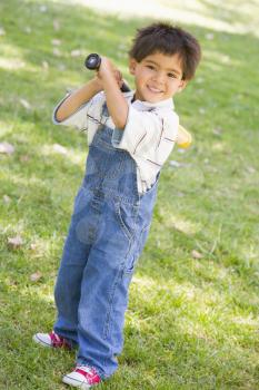 Royalty Free Photo of a Boy With a Baseball Bat