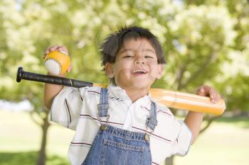 Royalty Free Photo of a Little Boy With a Baseball Bat