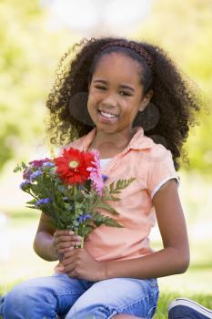 Royalty Free Photo of a Young Girl With Flowers