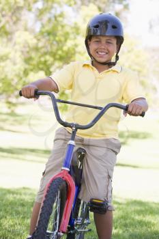 Royalty Free Photo of a Boy on a Bike