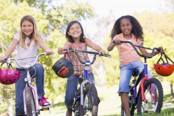 Royalty Free Photo of Three Girls on Bikes