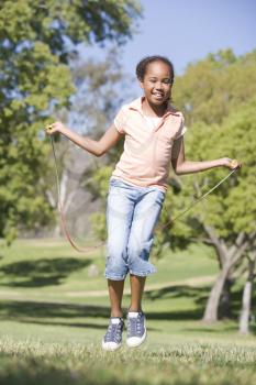 Royalty Free Photo of a Girl Skipping