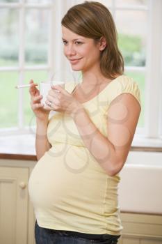 Royalty Free Photo of a Pregnant Woman With a Cigarette and Coffee
