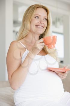 Royalty Free Photo of a Pregnant Woman With Tea