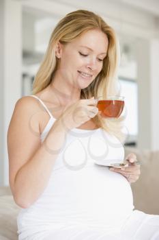 Royalty Free Photo of a Pregnant Woman Drinking Tea