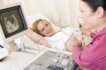 Royalty Free Photo of a Woman Getting an Ultrasound