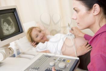 Royalty Free Photo of a Woman Getting an Ultrasound