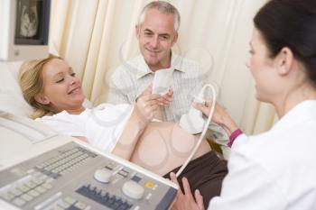 Royalty Free Photo of a Pregnant Woman Having an Ultrasound