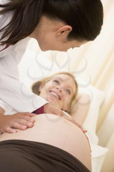 Royalty Free Photo of a Pregnant Woman Having a Checkup