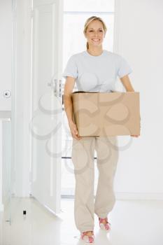 Royalty Free Photo of a Woman Moving In To a New Home