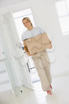 Royalty Free Photo of a Woman Moving Into a New Home
