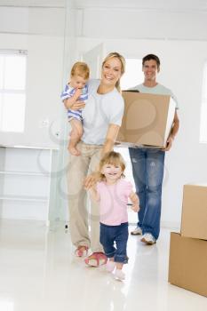 Royalty Free Photo of a Family Moving In To a New Home