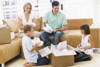 Royalty Free Photo of a Family Unpacking Boxes
