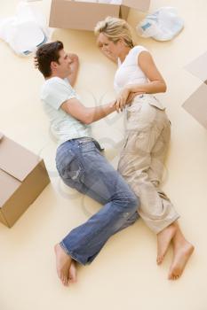 Royalty Free Photo of a Couple Lying on the Floor