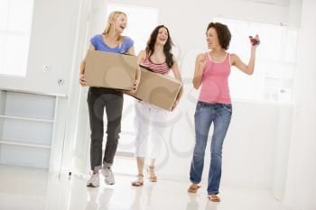Royalty Free Photo of Three Girls Moving In To a New Home