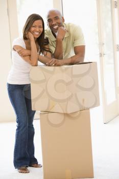 Royalty Free Photo of a Couple Beside a Box