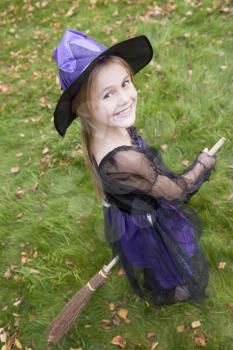 Royalty Free Photo of a Young Girl Dressed as a Witch