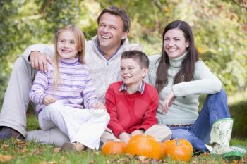 Royalty Free Photo of a Family With Pumpkins