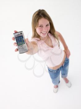Royalty Free Photo of a Teenage Girl Holding a Cellphone