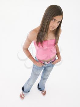 Royalty Free Photo of a Young Girl With Her Hands in Her Pockets