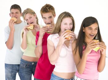 Royalty Free Photo of Five Kids Eating Burgers