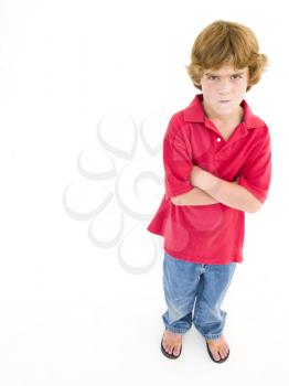 Royalty Free Photo of a Boy With His Arms Crossed